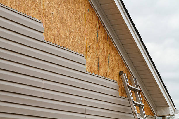 Professional Storm Damage Siding Repair technician working in Gladstone, OR